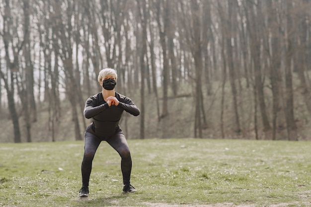 Masked woman training during coronavirus