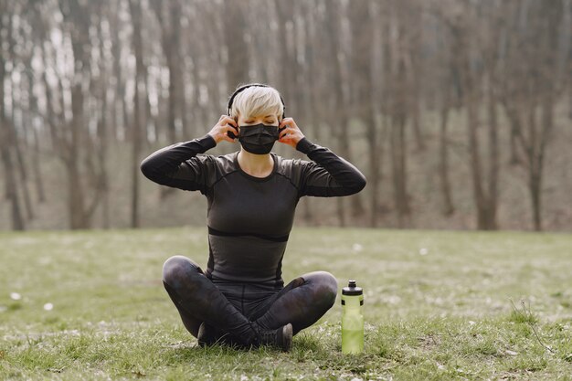 Masked woman training during coronavirus