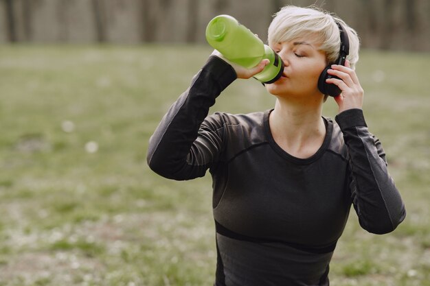 Masked woman training during coronavirus