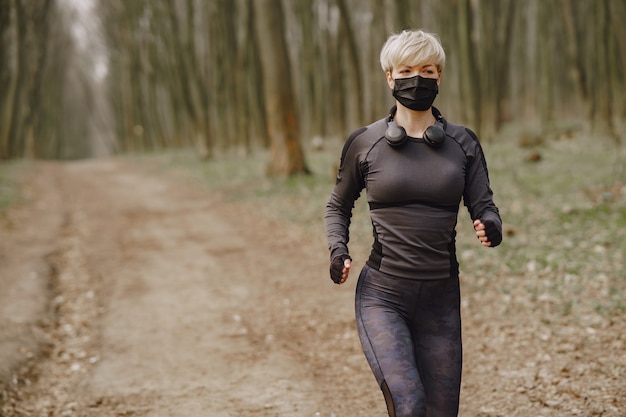 Masked woman training during coronavirus