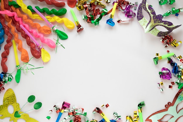 Masks amidst balloons and confetti