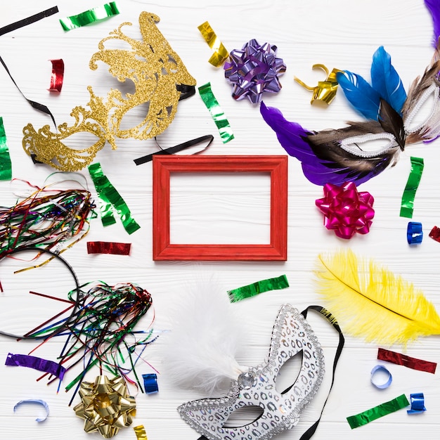 masks and confetti around red frame