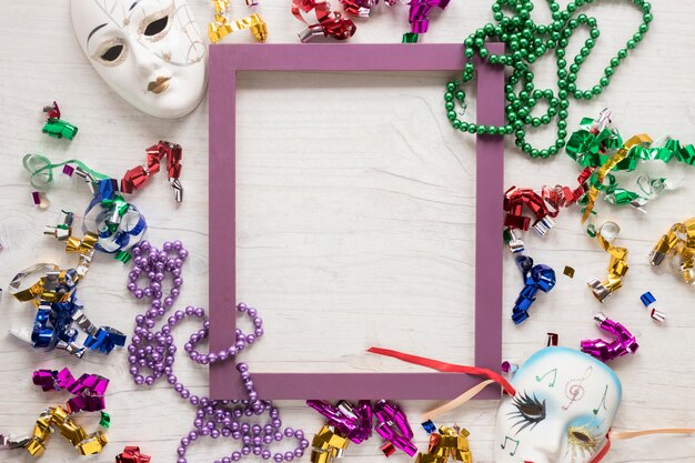 Masks and confetti with beads around frame