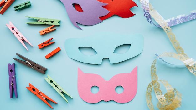 Masquerade  masks near pins and ribbon