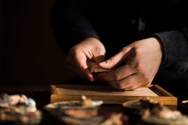 Master making stone sculptures in the atelier