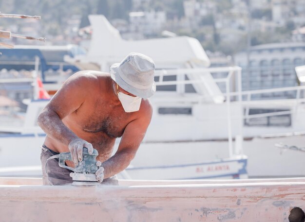 the master restores the yacht in marine