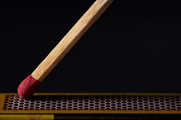 match and box with dark background