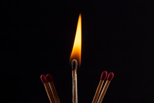 Match burning with dark background