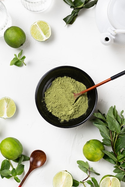 matcha and limes on a white background