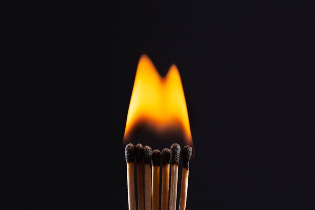 matches burning with dark background