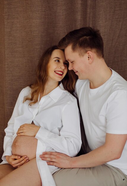 Maternity photos of a couple in studio