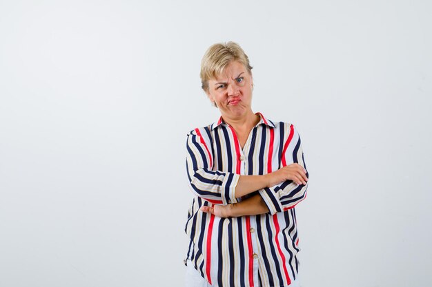 Mature blonde woman in a vertical-striped shirt