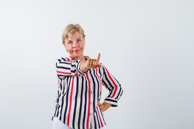 Mature blonde woman in a vertical-striped shirt