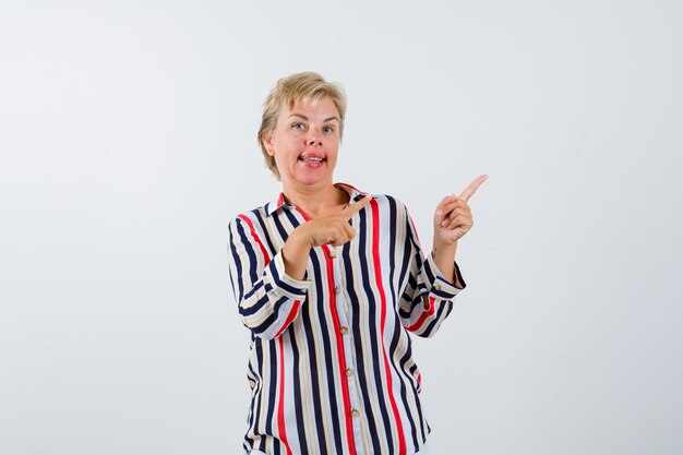 Mature blonde woman in a vertical-striped shirt