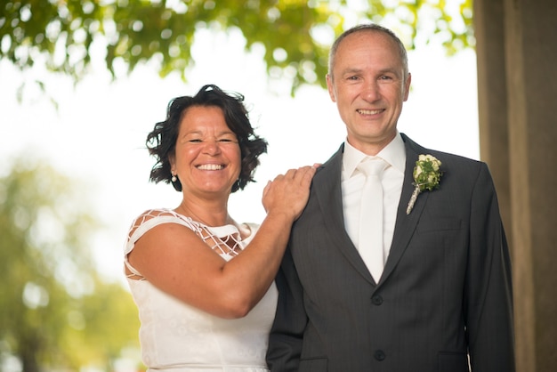 Free photo mature bride and groom getting married