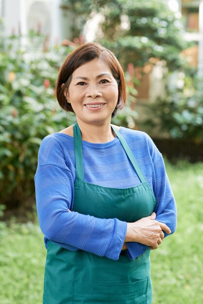 Mature gardener standing outdoors