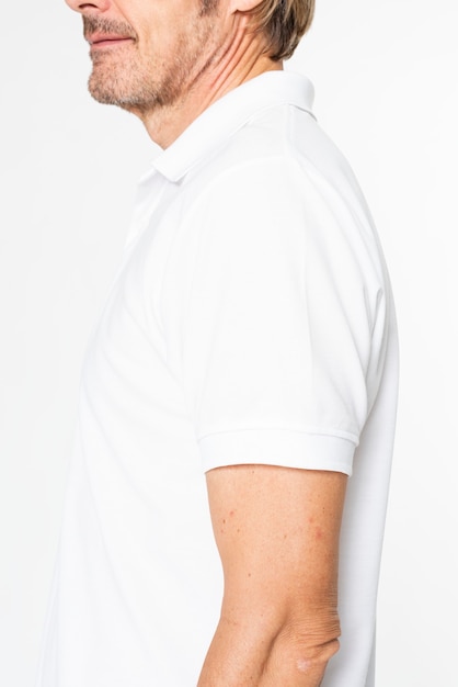 Mature man in basic white polo shirt with design space