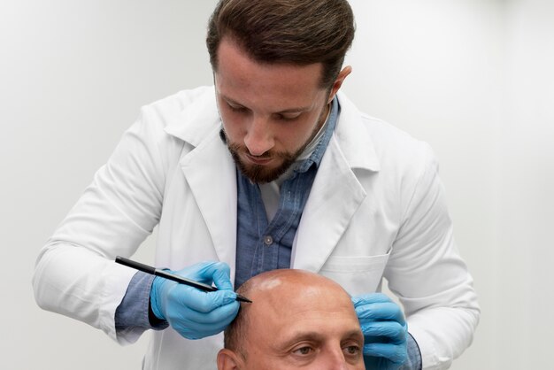 Mature man going through a follicular unit extraction process