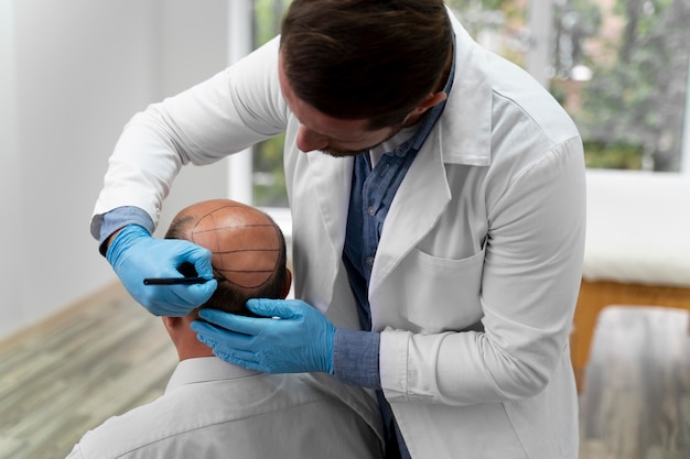 Mature man going through a follicular unit extraction process