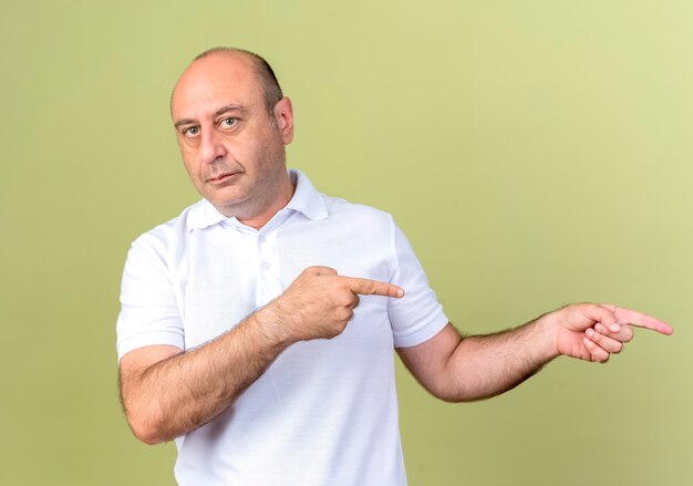mature man points at side 