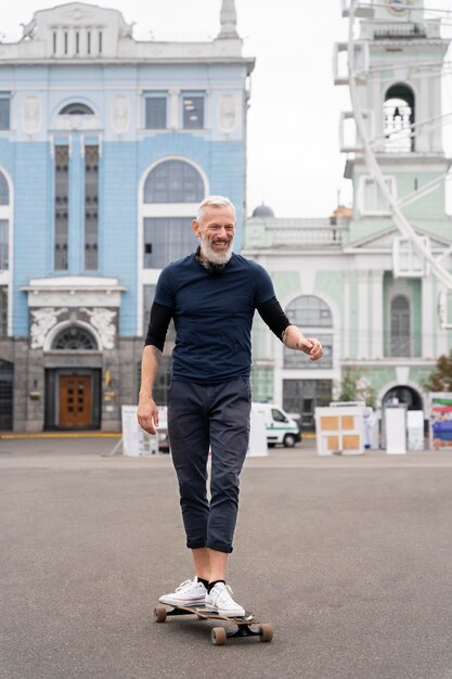 Mature man with sustainable mobility skateboard