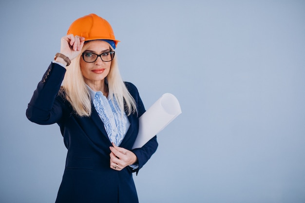 Mature woman architect in hardhat