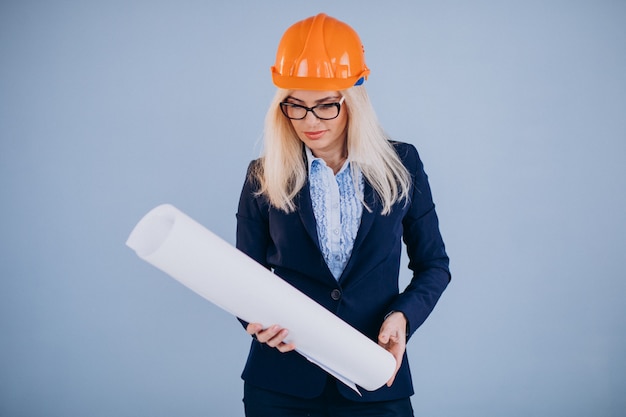 Mature woman architect in hardhat