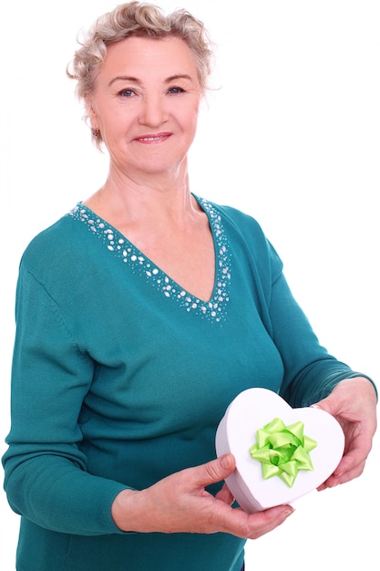 Mature woman holding giftbox