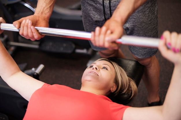 Mature woman lifting a barbell