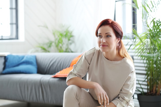 Mature woman in living room