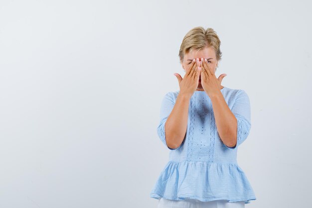 Mature woman posing in the studio