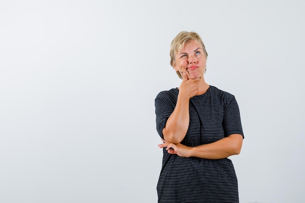 Mature woman posing in the studio