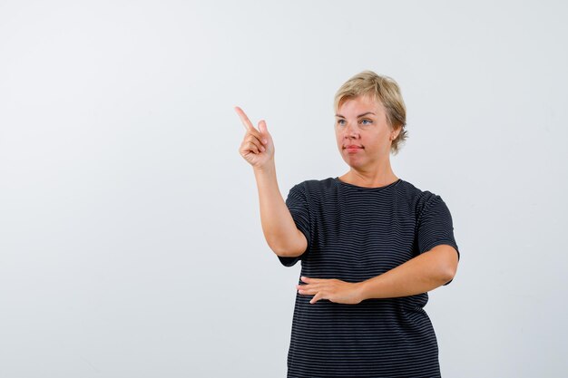 Mature woman posing in the studio