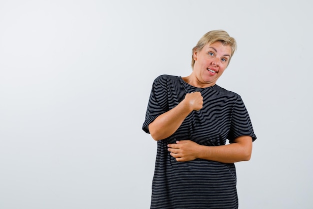 Mature woman posing in the studio