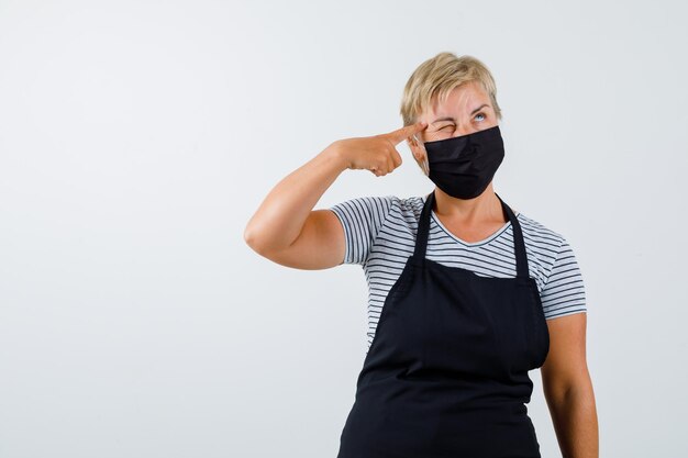 Mature woman posing in the studio