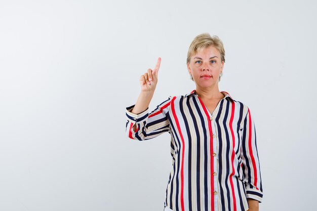 Mature woman posing in the studio