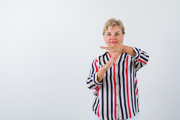 Mature woman posing in the studio