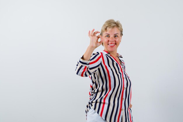 Mature woman posing in the studio