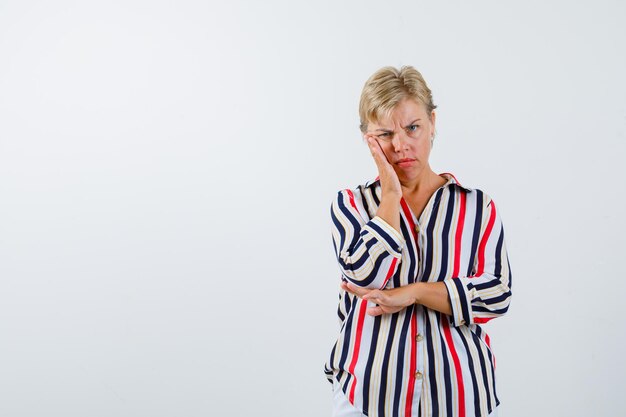 Mature woman posing in the studio