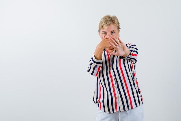 Mature woman posing in the studio