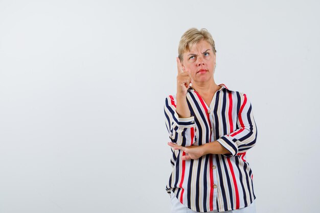 Mature woman posing in the studio