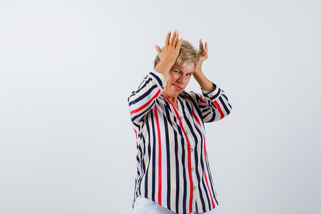 Mature woman posing in the studio