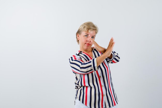 Mature woman posing in the studio