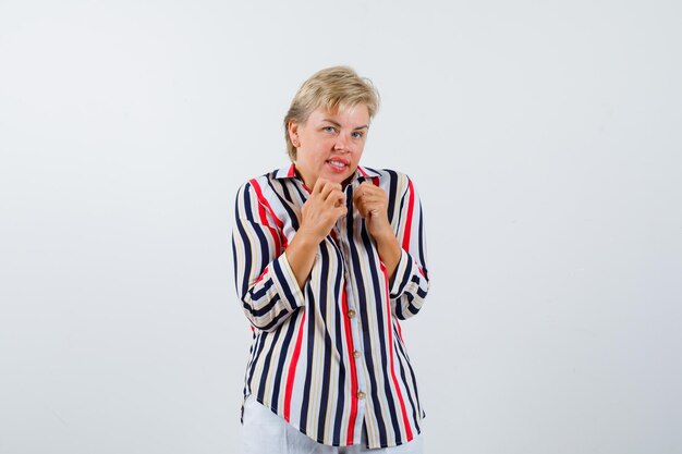 Mature woman posing in the studio