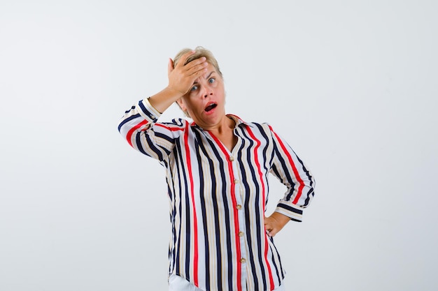 Mature woman posing in the studio