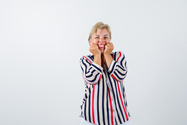 Mature woman posing in the studio