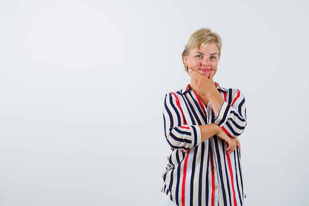 Mature woman posing in the studio