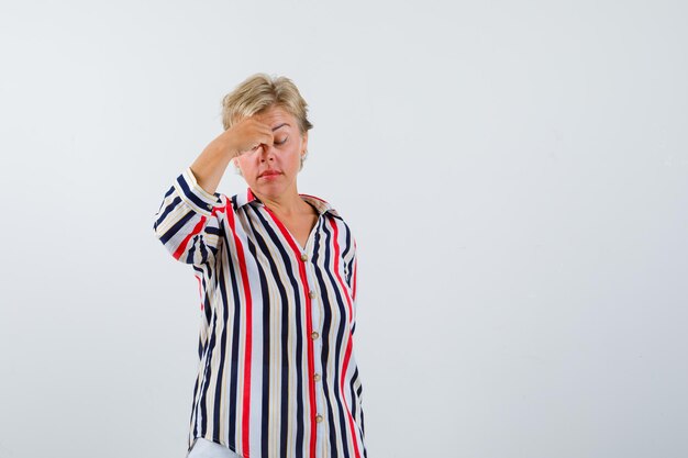 Mature woman in a vertical-striped shirt