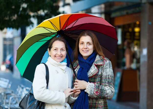 mature woman with adult daughter  in autumn