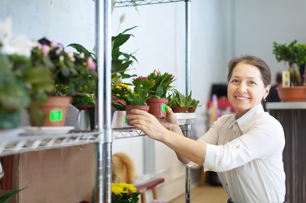 mature woman with Schlumbergera plant